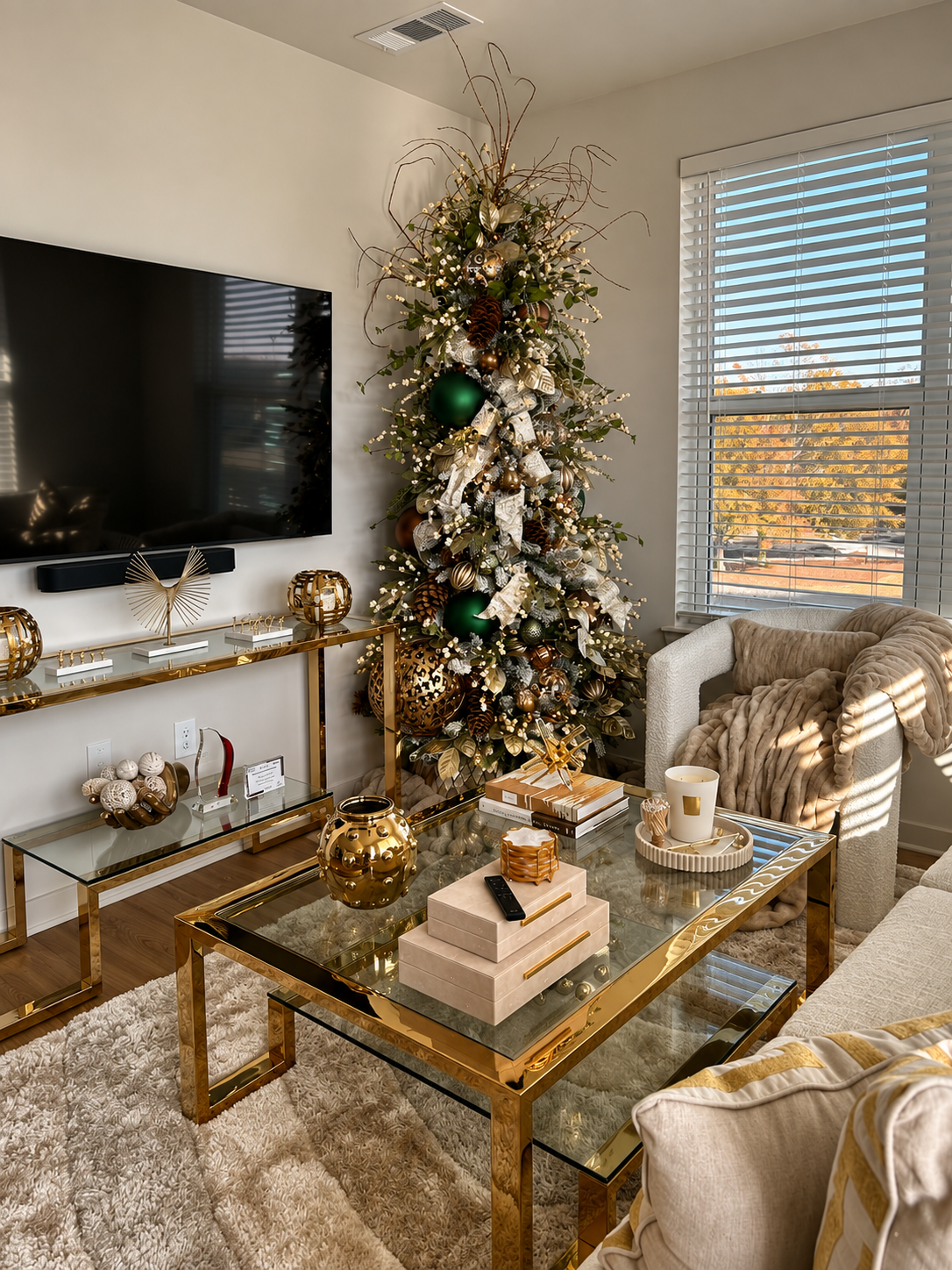 Modern living room with organic Christmas tree and gold accents