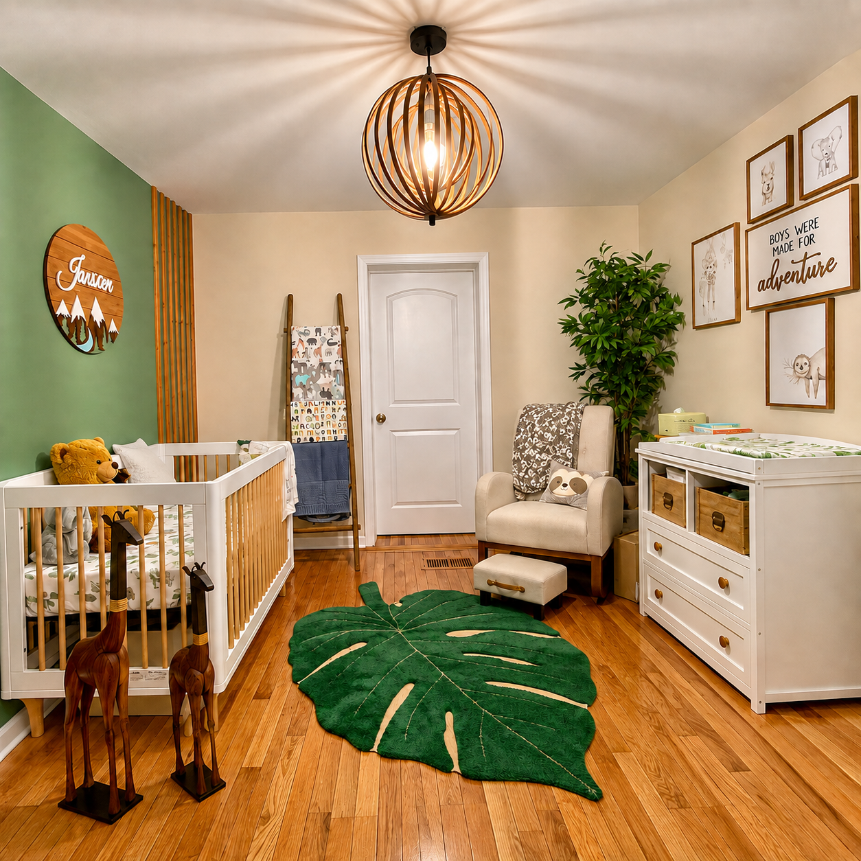 Safari adventure nursery with sage green accent wall, monstera leaf rug, white crib, and gallery wall of animal prints