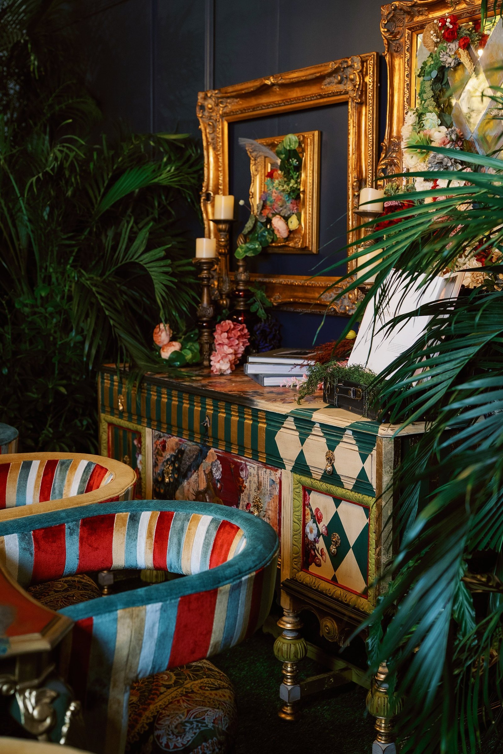 Hand-painted peacock-motif sideboard with teal and gold harlequin patterns among palm fronds